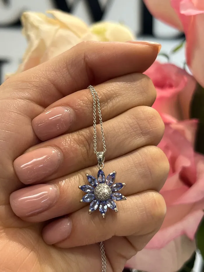 Crown Jewels Coin Necklaces 499 14 Karat Diamond and Tanzanite Flower Pendant